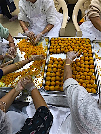 Preparing a traditional Indian sweet, motichur na, for patrons of the temple’s Shayona Café. Photo by Naimi Patel.